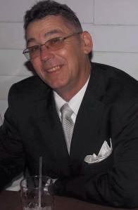 Wearing a suit in July.